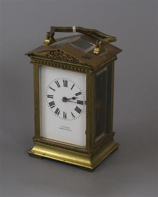 A French lacquered brass carriage timepiece